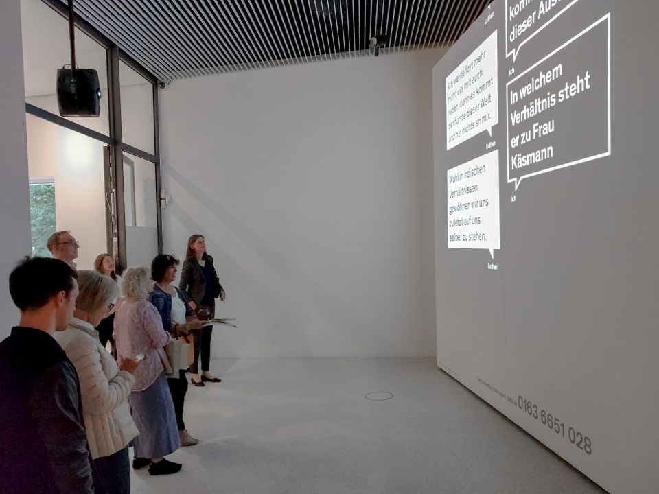 exhibition visitors in front of the installation